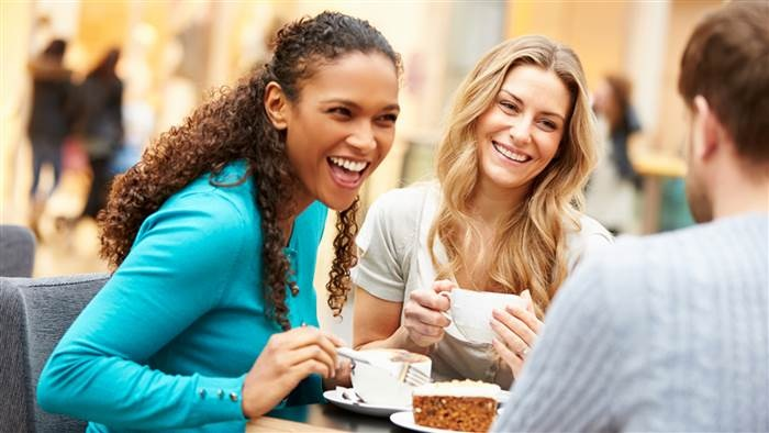 Friends talking over a meal